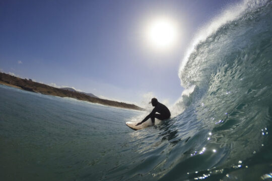 surfer in the tube of a wave by InsiderFuerteventura